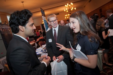 Tarush Agarwal '10, left, of Disney Consumer Products, speaks with Elisabeth Day '14, an art and English double major, and Matt McKenzie '14, an international affairs major.