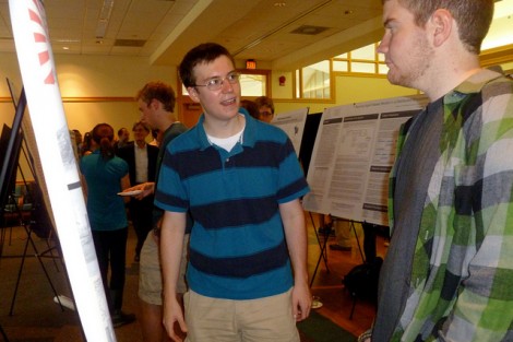 History major Jonathan Dever '13, left, presented research he performed with Paul Barclay, associate professor of history, on the visual culture of Japan during World War II.