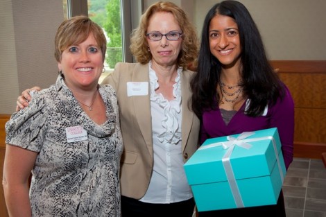 Rachel Nelson Moeller ’88, left, executive director of alumni relations, and Linda Arra, center, director of career services, present Nalishha Mehta '98 with The Lois and Neil Gagnon Award.