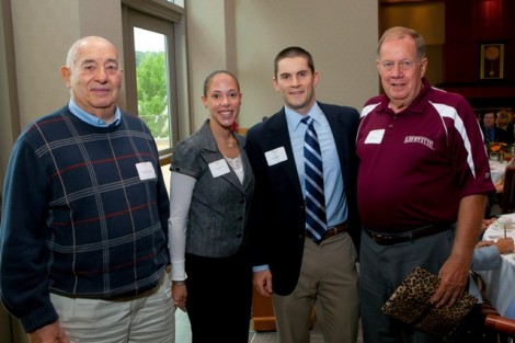 Elizabeth Anderson, second from left, and Brook Wolcott, second from right, both assistant directors of the Annual Fund, present Hank Kohlenberger '51, left, and Bob E. Moss '57, right, with the Julius Naab '19 Award.