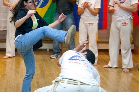 Lizzie Wilson '13 spars with members of Abada-Capoeira.