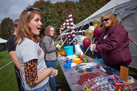 Nicole Catino '13 looks at the prizes as she gets ready to take part of the Duck Derby.