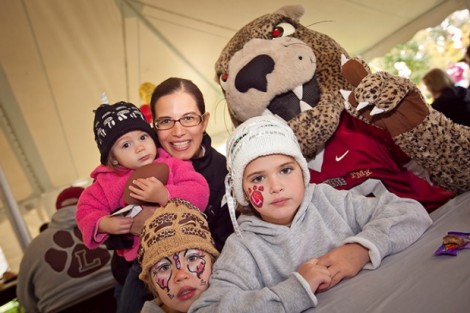 The family of Ted Cole '99, from left, Melina, mother Kalli, LIinna, and Evalyse with the Leopard. 