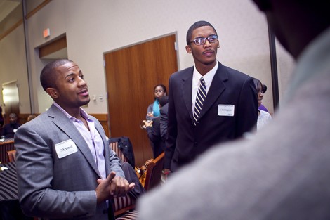 Nkrumah Pierre '06, co-chair of McDonogh Network, speaks with students.