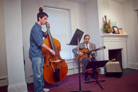 John Paul Bisciotti '14, left, and Jorge Torres, associate professor of music, perform during the reception.