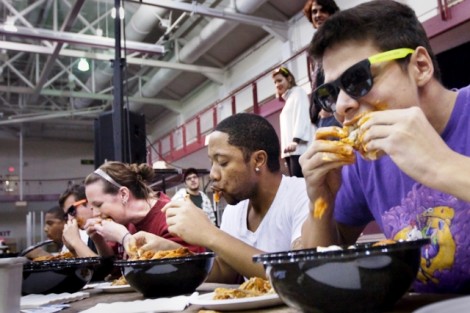 Students compete in the wing-eating competition.