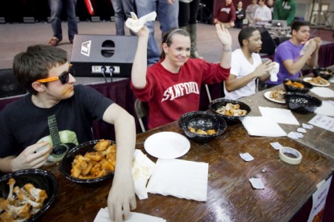 Kerry Donohue '14 celebrates after winning the wing-eating competition.