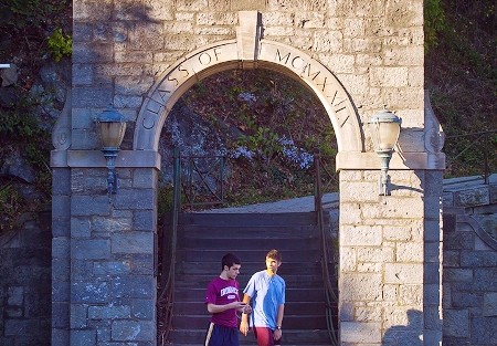 Students walk through the stone archway on North Third Street.