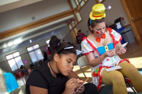 Emily Melvin '12, right, plays games with the children.