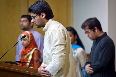 Hassaan Khan '14, dressed in a traditional Shalwar kameez, leads a Muslim prayer at the start of dinner.