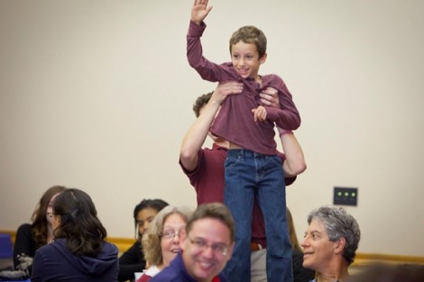 Dale Berkove, 8, son of Ethan Berkove, associate professor of mathematics, raises his hand to play a quiz game.