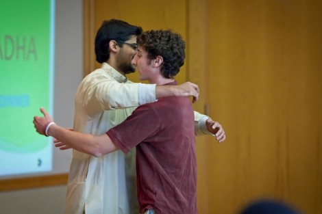 Hassaan Khan '13, left, hugs Evan Gooberman '13, president of Hillel Society, three times, which is tradition during Eid-al-Adha.