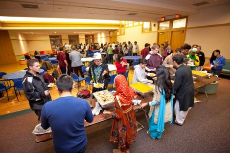 Students serve traditional Muslim fare to guests.