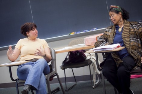 Jayne Cortez, right, talks about her poetry with students in the creative writing course taught by Elizabeth Rosen, visiting instructor of English. 