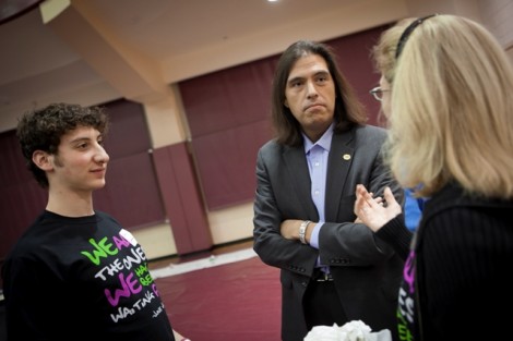 Evan Gooberman '13, left, speaks with Celestino Limas, vice president for campus life, and Jodi Frey, associate dean and director of recreational services.