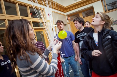 Anna Baruzzi '14, left, ties balloons together as Avery Jackson '14, right, watches. 