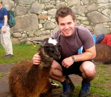 Justin Barry '12 with a llama at Machu Picchu