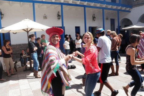 Kelly Senters '13 dances with a local in Cusco