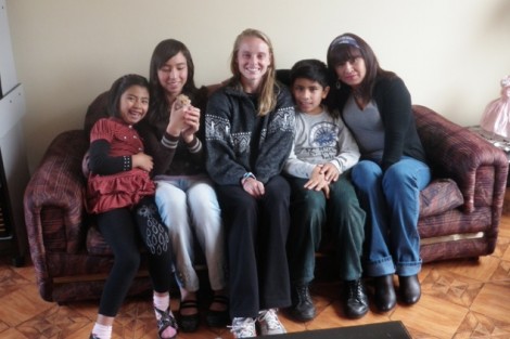 Kelly Senters '13 with her host family in Cusco