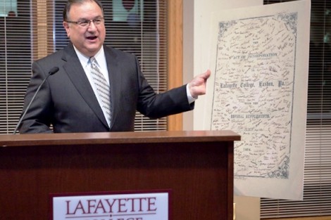 Easton mayor Sal Panto holds an enlargement of the Lafayette Charter as he talks during Dine 3/9.