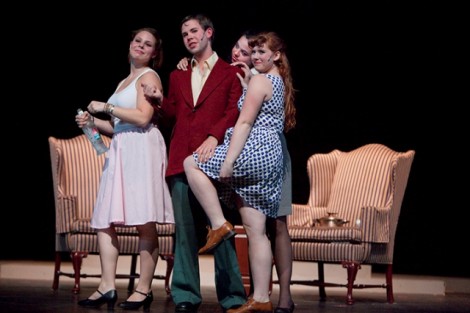 Tom Yeager '13 (as Alan Swann) surrounded by women 