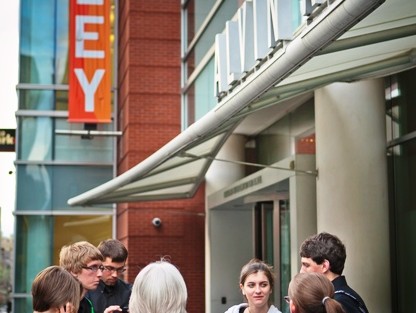 Students and faculty talk outside the Alvin Ailey Theater.