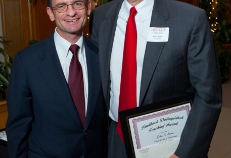 President Daniel Weiss, left, with John Shaw, associate professor of psychology, who received the Christian R. and Mary F. Lindback Foundation Award