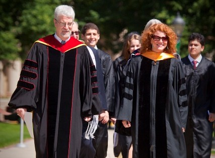 John Colatch, chaplain of the College and director of religious and spiritual life, and Jennifer Kelly, assistant professor of music and director of choral activities, lead the procession.