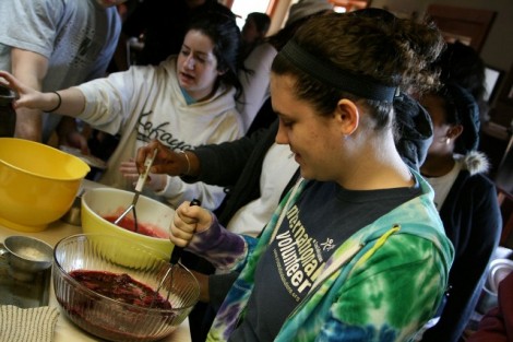 Tennessee- Megan Cassidy '12 (left) and Jocelyn Bookman '14 make raspberry jam at Once Upon a Camp in Tennessee, an outreach to the Cherokee tribe in North Carolina and Tennessee.