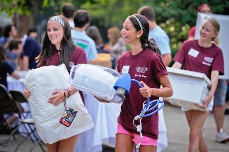 Volunteers help first-year students move in to McKeen and Gates Halls.
