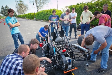 The students assemble some of the car.