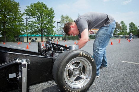 Andrew Koch '12 works on the car.