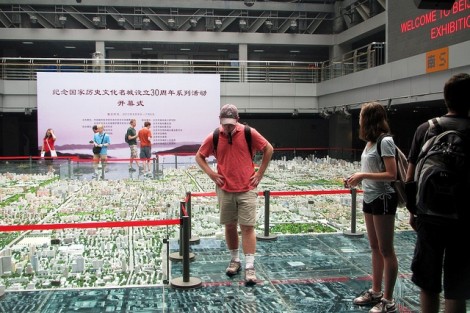 Matthew Powell '15 (center) and Hannah Komar '13 observe the miniature of the entire city of Beijing inside the Urban Planning Center, Beijing.