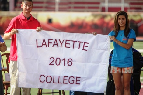 Ryan Burke ’16 and Ani Acopian ’16 receive the Class of 2016 flag.