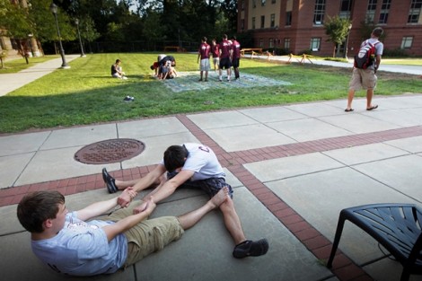 Stephen Mazich '15, left, and Ian Crowley  '15 stretch out before playing Twister.