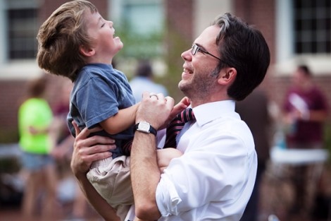 John O'Keefe, associate vice president of ITS, plays with his son, Miles, during START Fest.