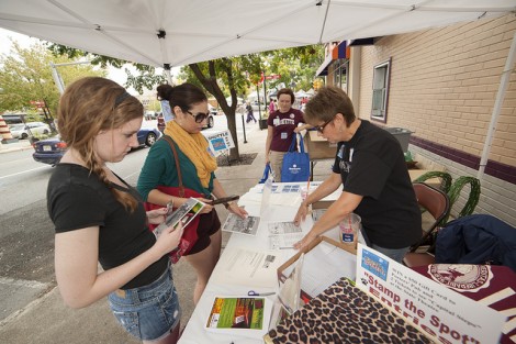 Donna Krivoski, director of Parent Relations, gives students brochures at the Lafayette Day tent near Centre Square in downtown Easton.