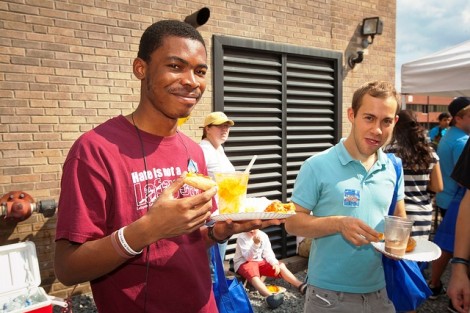 Yehou Gnopo '15 and Martin Adams '14 enjoy the food and music in the Bank Street Alley in downtown Easton.