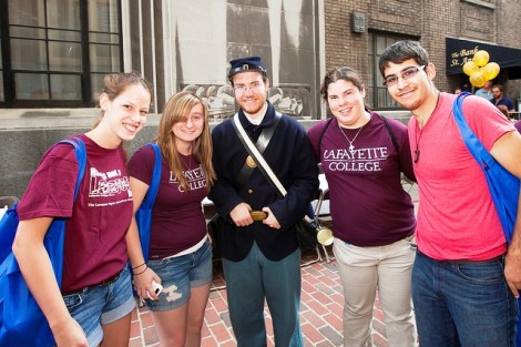 Students attend Lafayette Day in Bank Street Alley. They are (from left) Rebecca Murray '15, Katelyn O'Connell 15, Civil War reenactor Jon Dever '15, Blair Gallante '15, and Gabriel Hernandez 15.