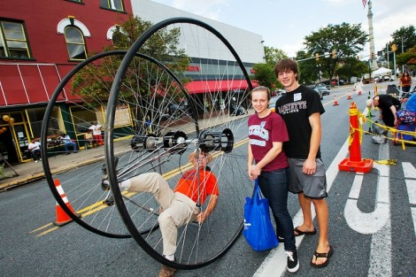 John Gehrig '15 and Allison O'Donnell '15 look at a demonstration of a special bicycle.