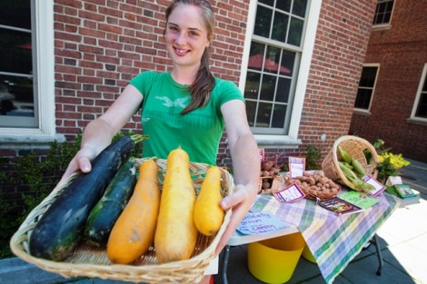 Annie Mikol '13 shows off some produce for sale at the Lafayette Organic Garden stand in front of Gilbert's Cafe. 