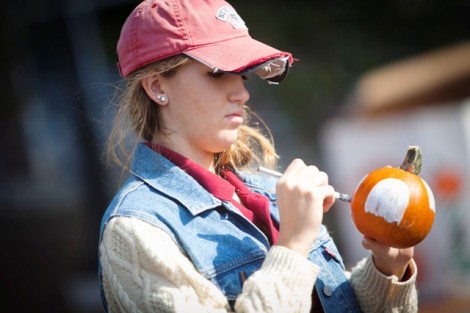 Katria Tomko '16 decorates a pumpkin. 