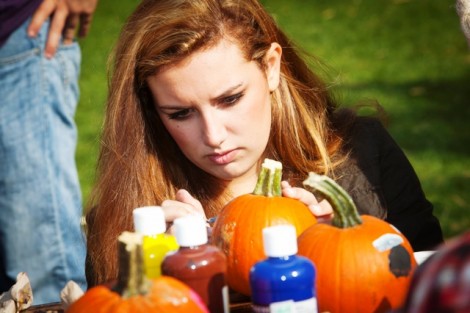 Olivia Hadley '16 decorates a pumpkin. 
