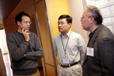 Yih-Choung Yu, center, associate professor of electrical and computer engineering, and Ismail Jouny, right, Dana Professor of electrical and computer engineering, discuss the ECE program with a parent.