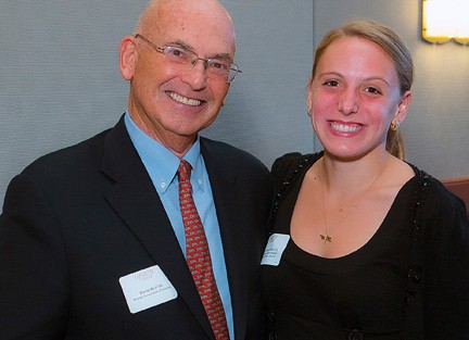 Julissa Muschlitz '13 (right) receives Student Volunteer Award from David Reif '68, president of the Alumni Association.