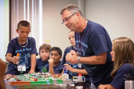 Students explore a watershed model with Art Kney, associate professor and head of civil and environmental engineering. 