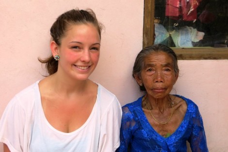 Ana Drehwing '13 with a new friend during a Balinese private temple dedication ceremony