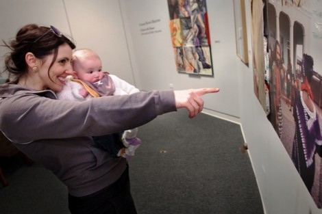 Emily Musil Church, assistant professor of history, explores the exhibit with her daughter.