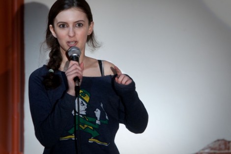 Ellen Corrini '16 completes a joke suggested by an audience member during comedy night.