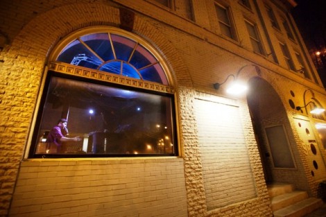 Stand-up comedian Danny Jolles' performance can be seen through the outside window at The Spot.